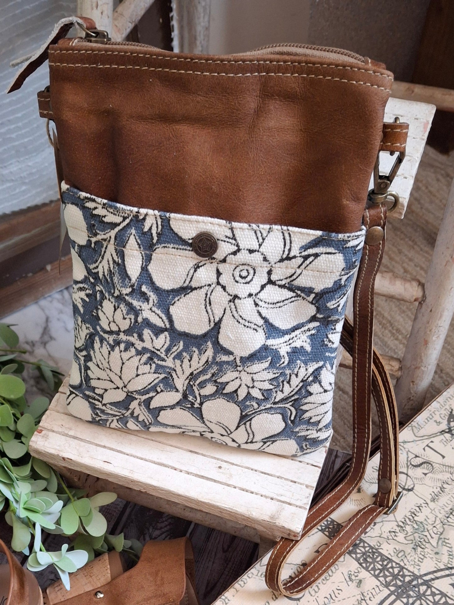 Whether you're navigating the urban jungle or heading out for a weekend getaway, this crossbody bag will keep your essentials secure while adding a touch of rugged elegance to your ensemble. It features a vintage blue and white stripe lining, two outside pockets, and an adjustable shoulder strap.
Designed & Manufactured in USA/Hand Crafted
