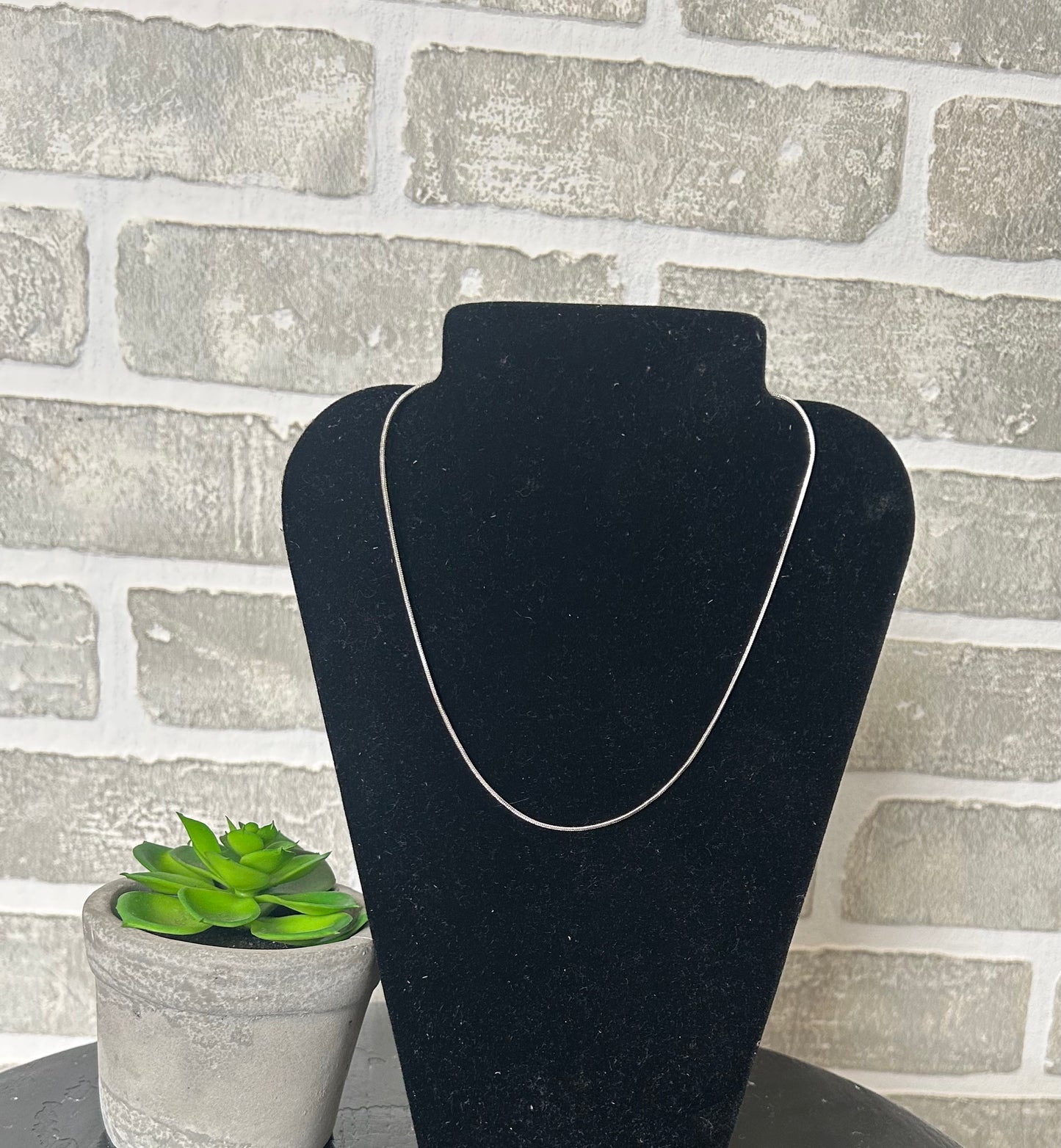 Simple Snake Chain! Its fluid movement adds a touch of elegance to any outfit. Versatile for wearing alone, layering, or adding your favorite charm or pendant from, this classic chain is a very versatile and consistently in style.
approximately 13" L + 3" extender