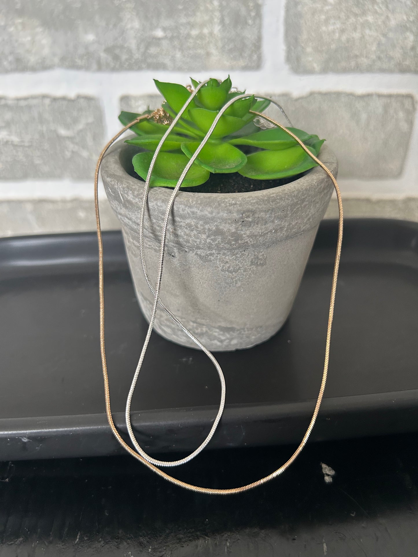 Simple Snake Chain! Its fluid movement adds a touch of elegance to any outfit. Versatile for wearing alone, layering, or adding your favorite charm or pendant from, this classic chain is a very versatile and consistently in style.
approximately 13" L + 3" extender