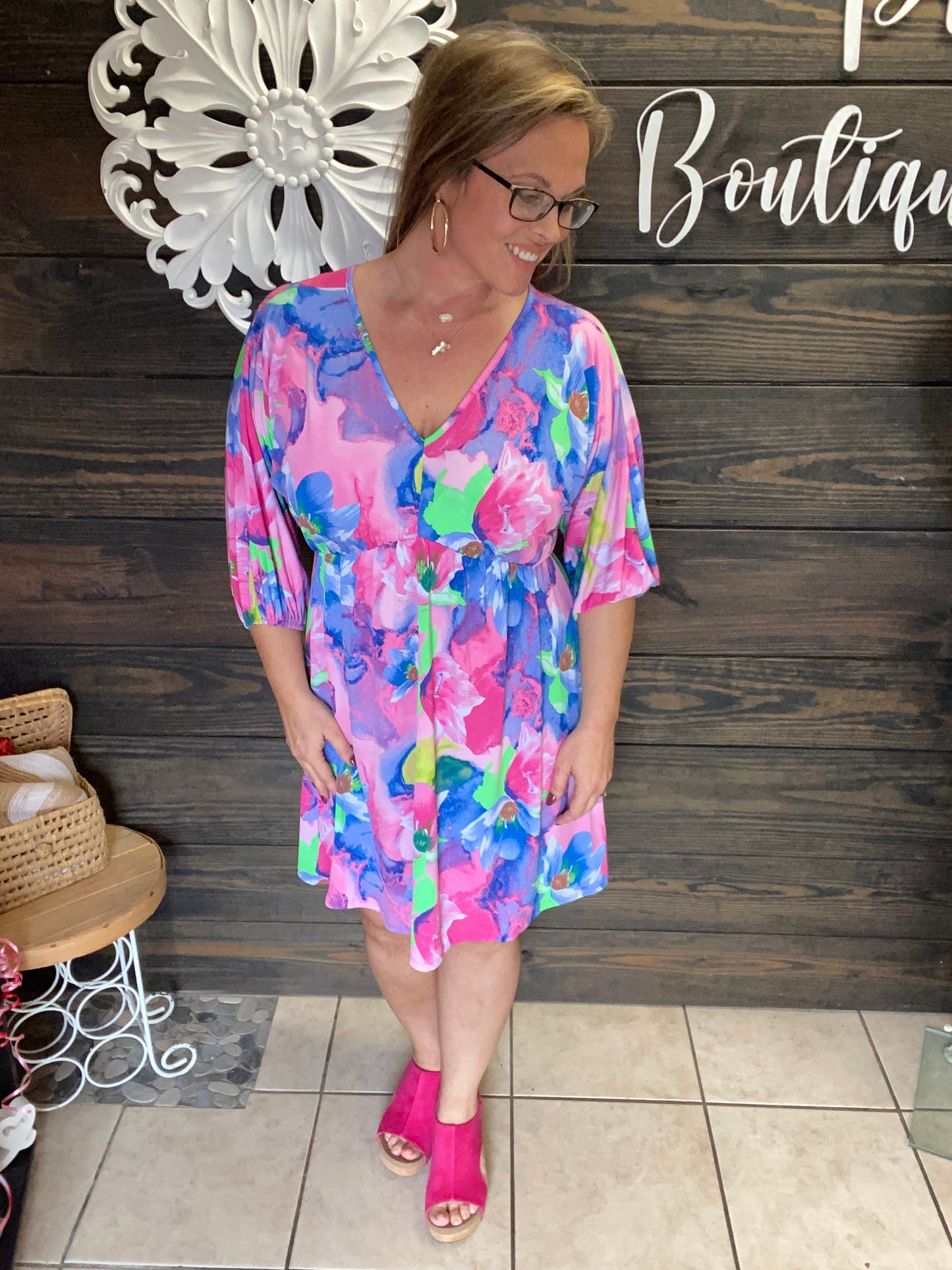 Colorful Tropical look dress, lightweight, flowy, 3/4 length sleeve, v neck in front and back, knee length, ties in back at neck.