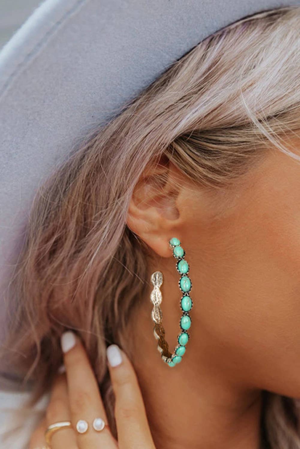 C shape hoop style earrings with a pop of blue green gemstones, large