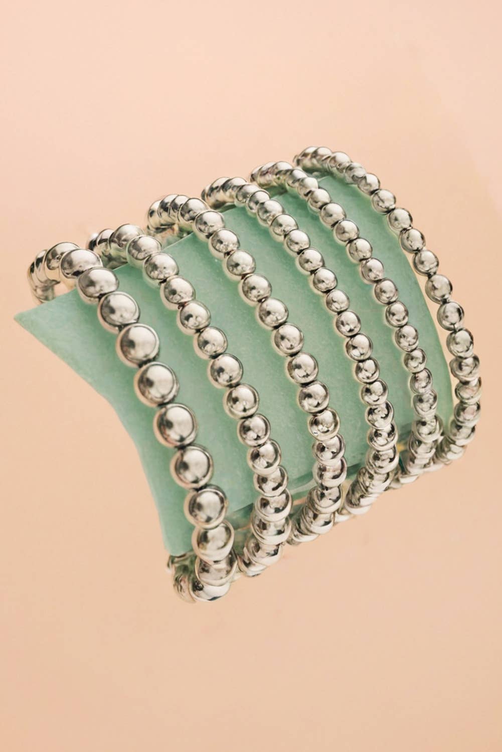 6 individual stretchable bracelets with varying sizes of beads
