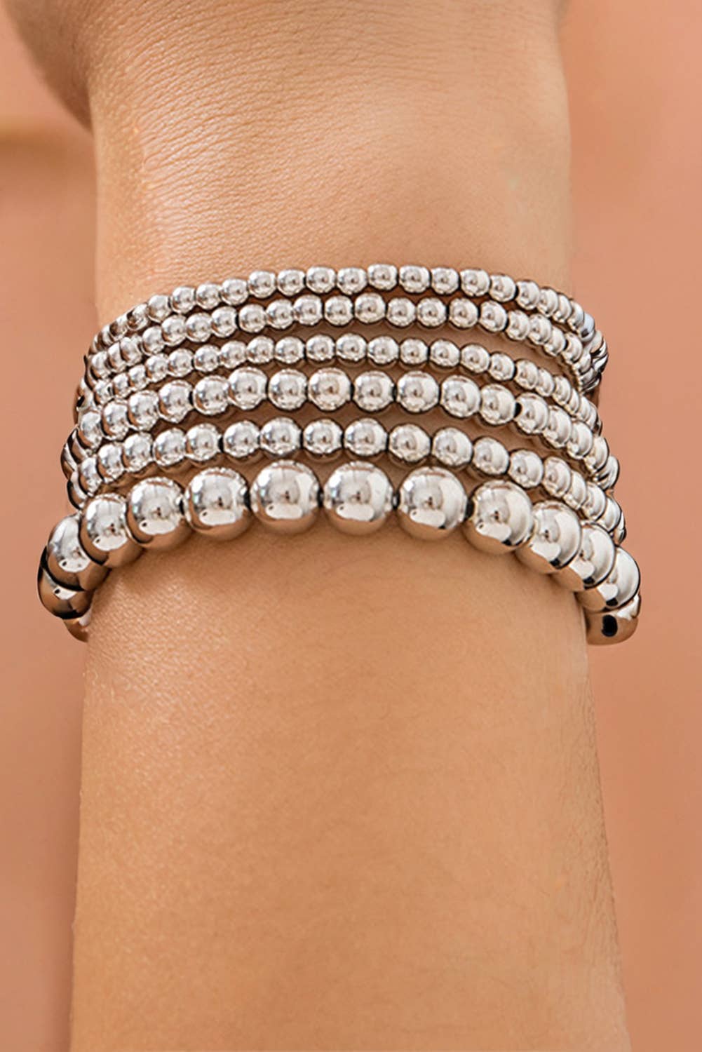 6 individual stretchable bracelets with varying sizes of beads