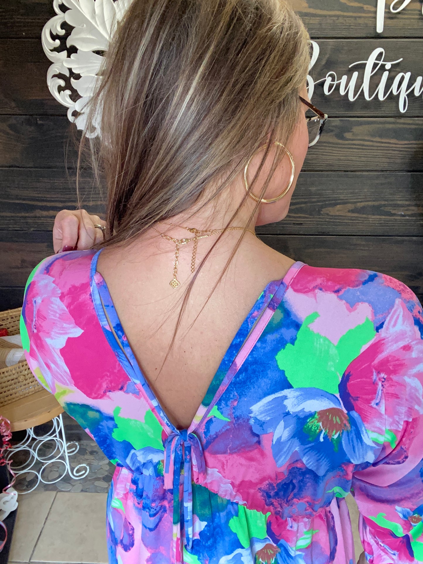 Colorful Tropical look dress, lightweight, flowy, 3/4 length sleeve, v neck in front and back, knee length, ties in back at neck.