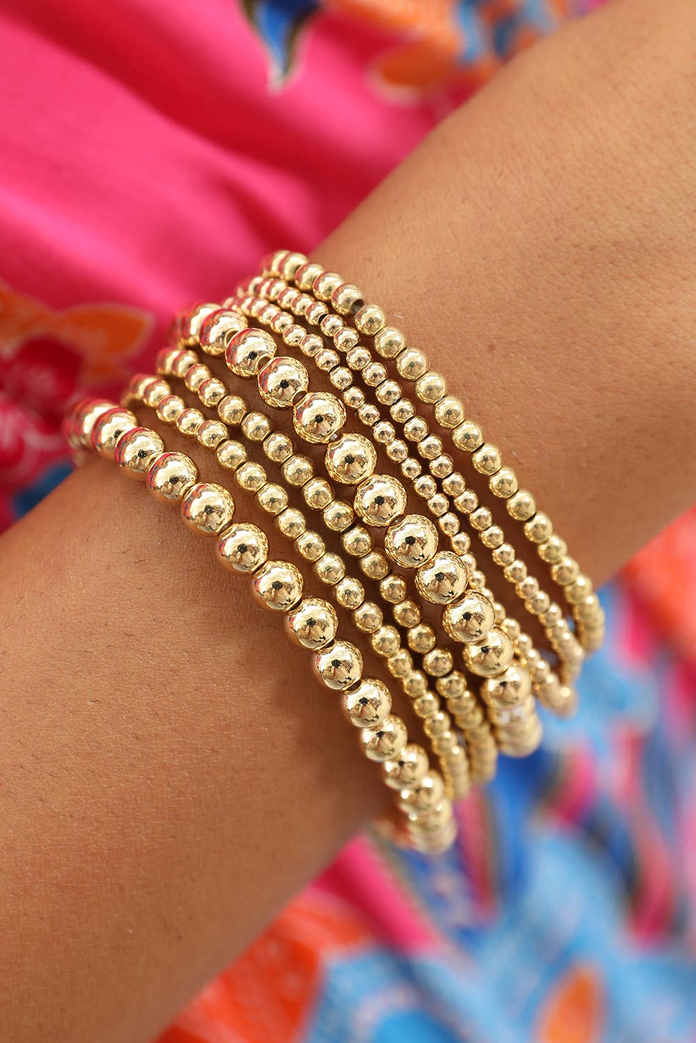 set of 7 separate stretch bracelets in varying sizes of beads