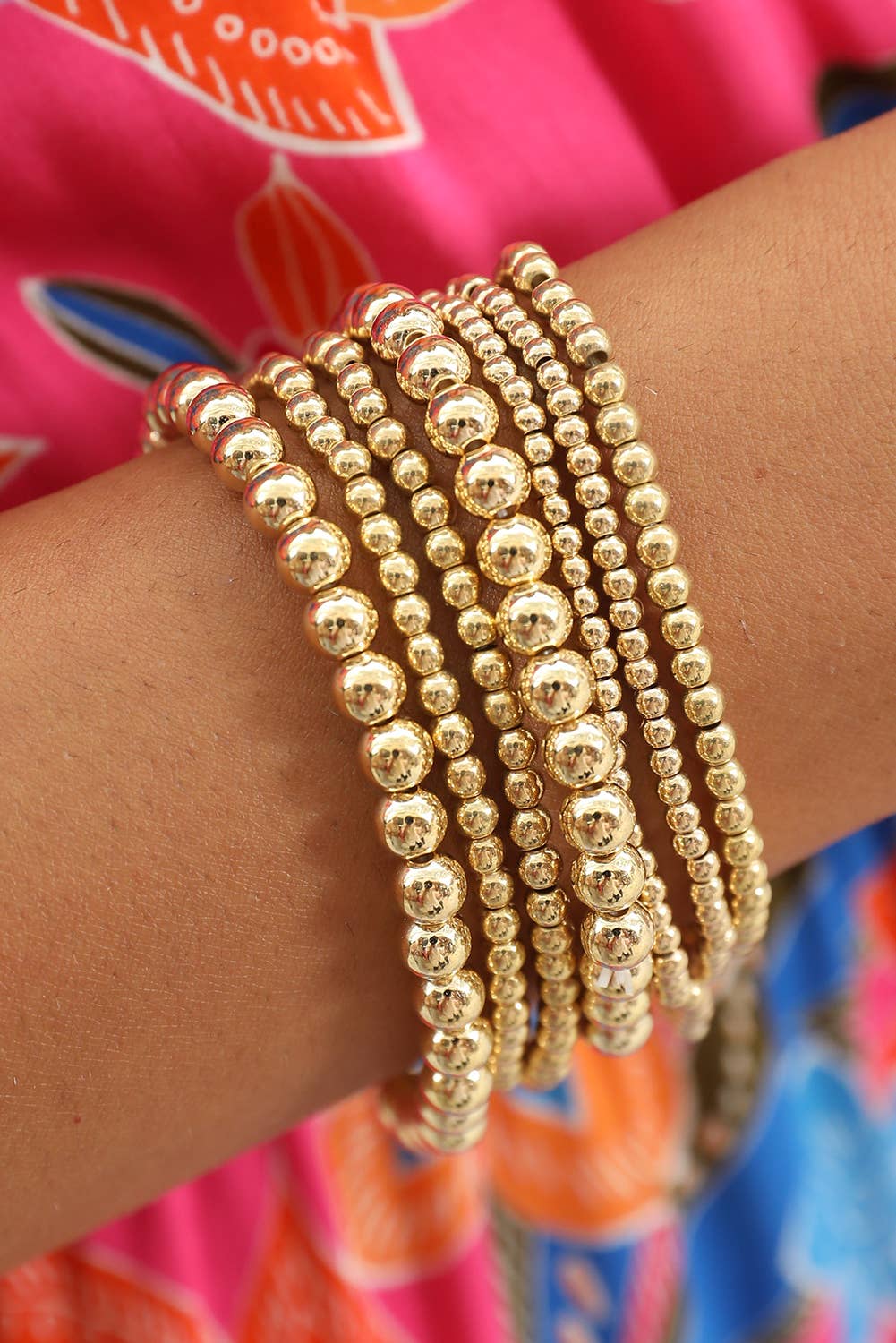set of 7 separate stretch bracelets in varying sizes of beads