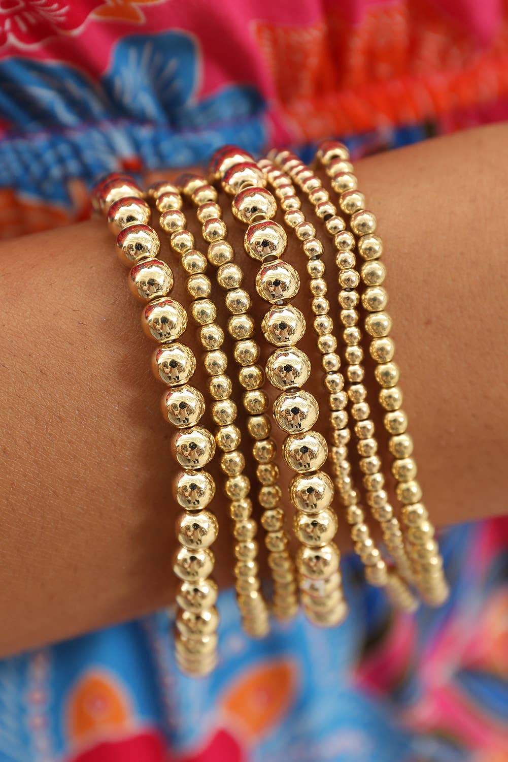 set of 7 separate stretch bracelets in varying sizes of beads