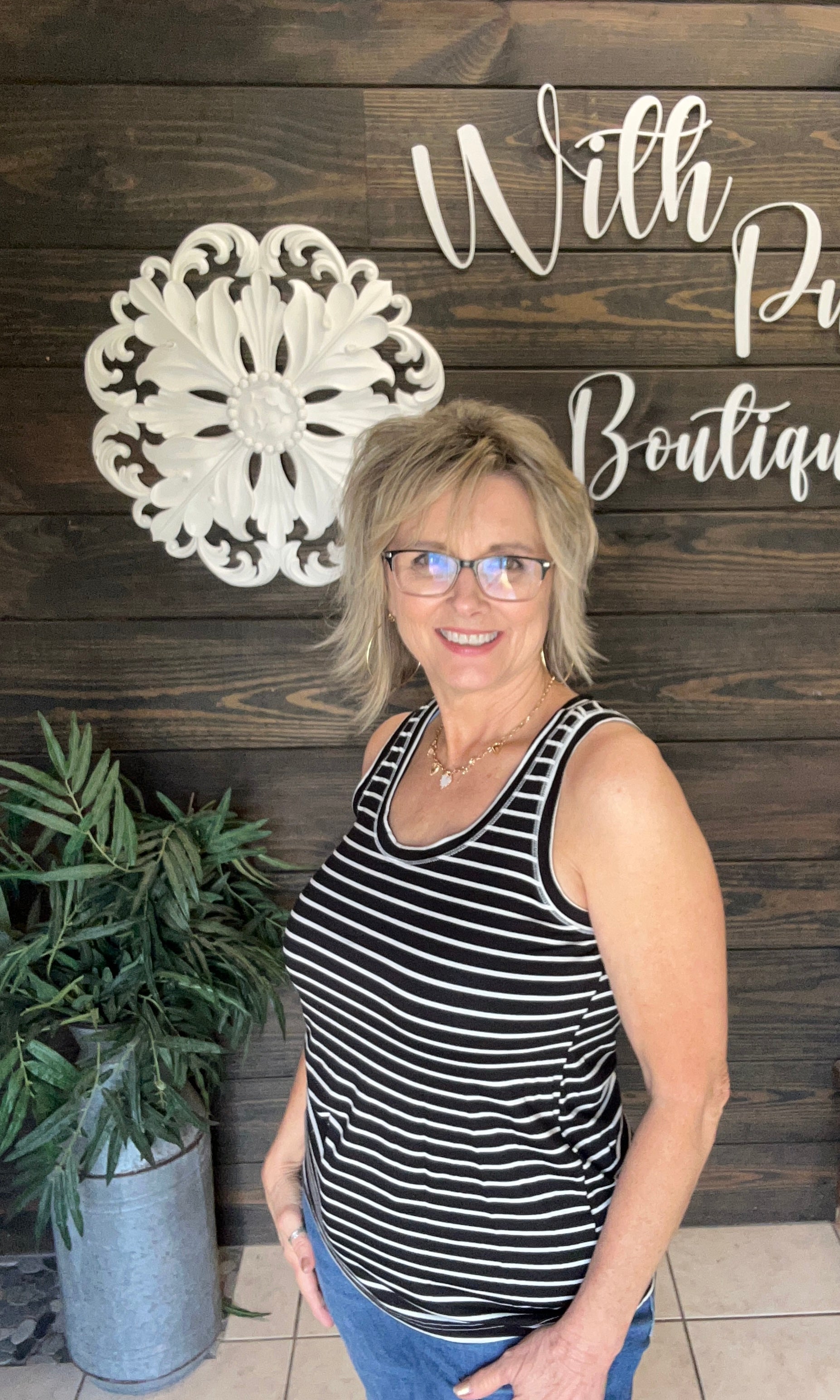Experience comfort and style with the Black &amp; Ivory Stripe Tank. Made from soft fabric, this trendy piece is perfect for warm summer days and ideal for layering as the weather cools. Its classic striped design and versatile fit make it an everyday staple. Elevate your wardrobe with this must-have tank that combines softness, style, and adaptability.

fits relaxed; could maybe size down