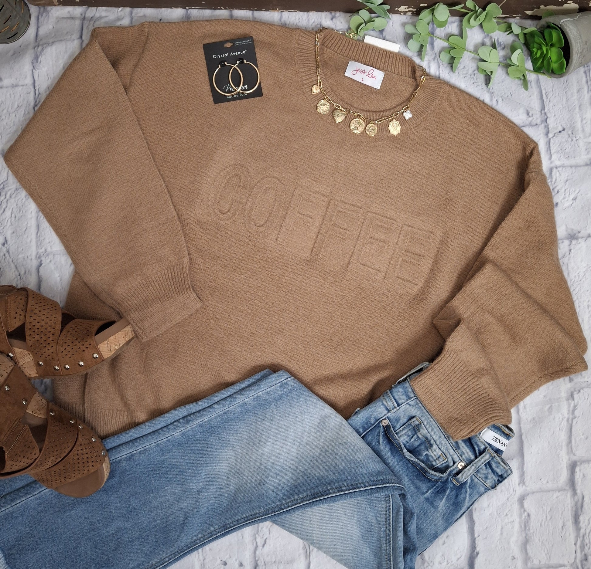 This embossed sweater doesn't just celebrate your love for coffee—it envelops you in exceptional softness and comfort while making a stylish impression. Elevate your daily wardrobe with this cozy piece that perfectly combines fashion and your passion for coffee.

61% Polyester, 39% Acrylic