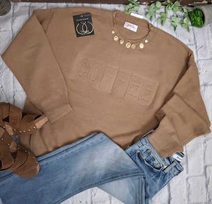 This embossed sweater doesn't just celebrate your love for coffee—it envelops you in exceptional softness and comfort while making a stylish impression. Elevate your daily wardrobe with this cozy piece that perfectly combines fashion and your passion for coffee.

61% Polyester, 39% Acrylic