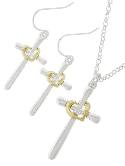 Elevate your style with our Silver/Gold Cross Necklace Set! Our exquisite silver cross is beautifully adorned with a gold heart and comes with matching earrings. Versatile and elegant, this set adds a touch of style to any outfit. Perfect for any occasion, wear it with all your colors!

approx 17" L