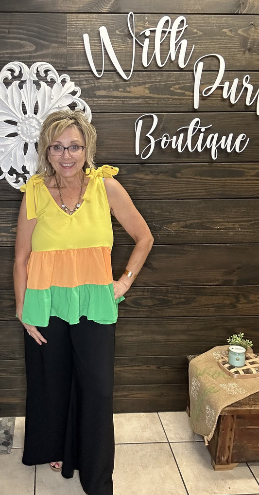 Introducing our Fiesta Tiered Tank Top! Perfect for bright and sunny summer days, this top features a chic tie detail at the shoulder and a loose, tiered fit that's both stylish and comfortable. Add a touch of fun and flair to your wardrobe with this must-have piece!

100% Polyester