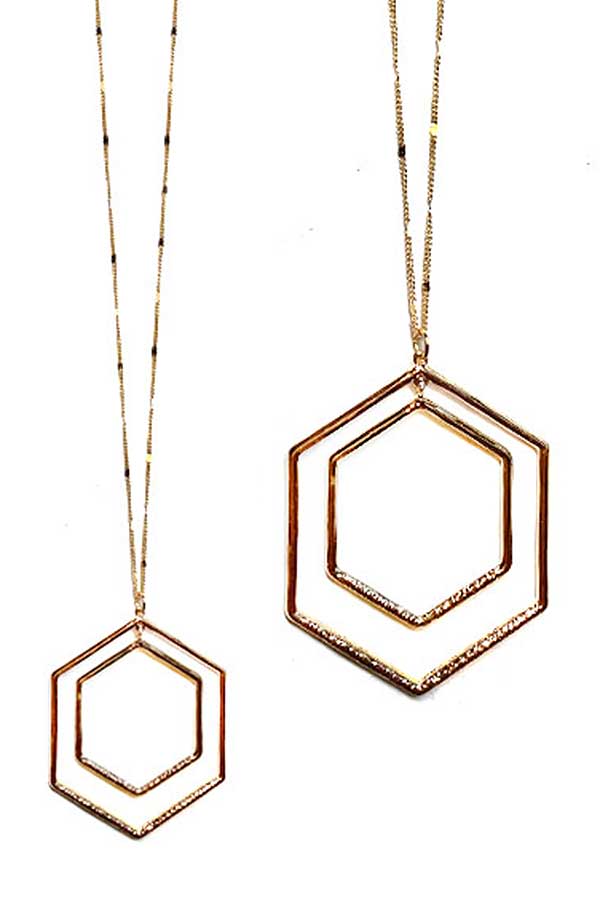 Two gold hexagonal pendants each on gold chains against a white background 