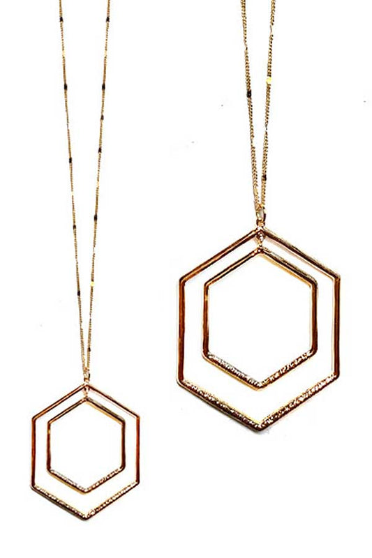 Two gold hexagonal pendants each on gold chains against a white background 