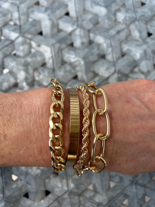 4 separate gold tone chain bracelet set