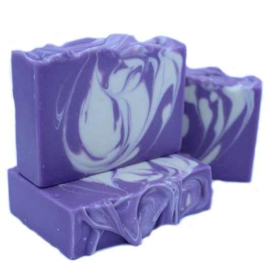 Purple and white swirled soap bars on a white background