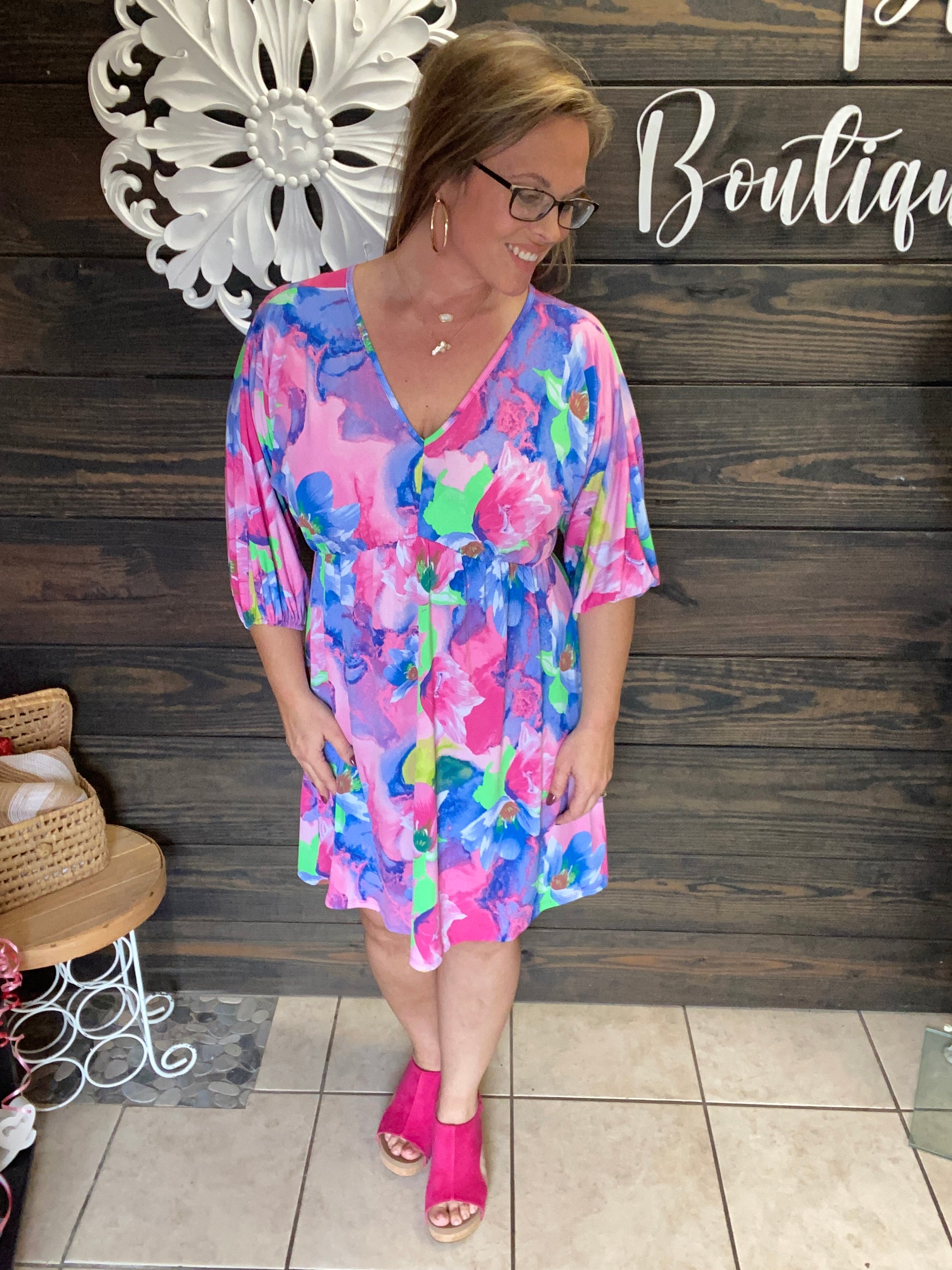 Colorful Tropical look dress, lightweight, flowy, 3/4 length sleeve, v neck in front and back, knee length, ties in back at neck.