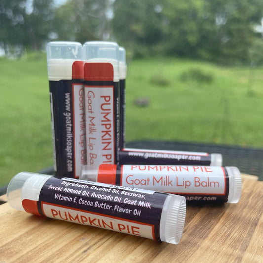 Pumpkin Pie Goat Milk Lip Balm - sitting on wooden table