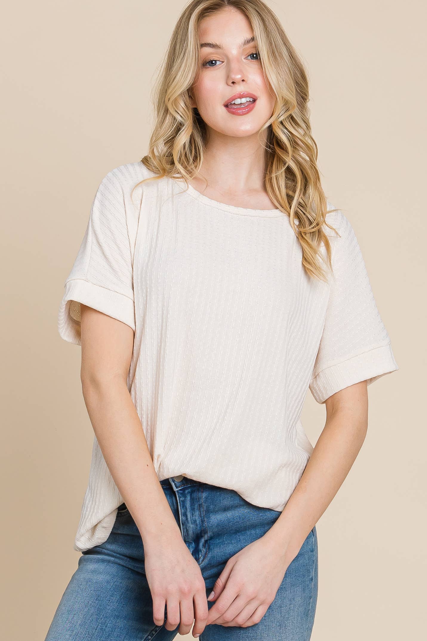 Upgrade your everyday basics with our Ribbed Knit Casual Tee. Designed with subtle vertical ribbing and a relaxed fit, this top brings just the right amount of texture and stretch to your look. The rolled short sleeves and scoop neckline add an effortless touch of style, making it perfect for layering or wearing solo.

Fit: Relaxed, slightly oversized

MADE IN USA!