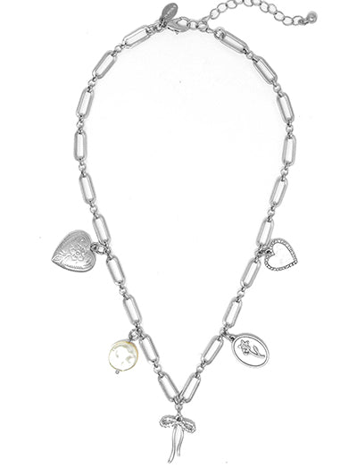 This necklace features a delicate bow and heart locket charm, adorned with beautiful flower charms, and more + sparkling pave details. The mother of pearl look adds an elegant touch, complementing the silver chain perfectly. Carry your loved ones close to your heart with this charming piece.

Approx. 16"
