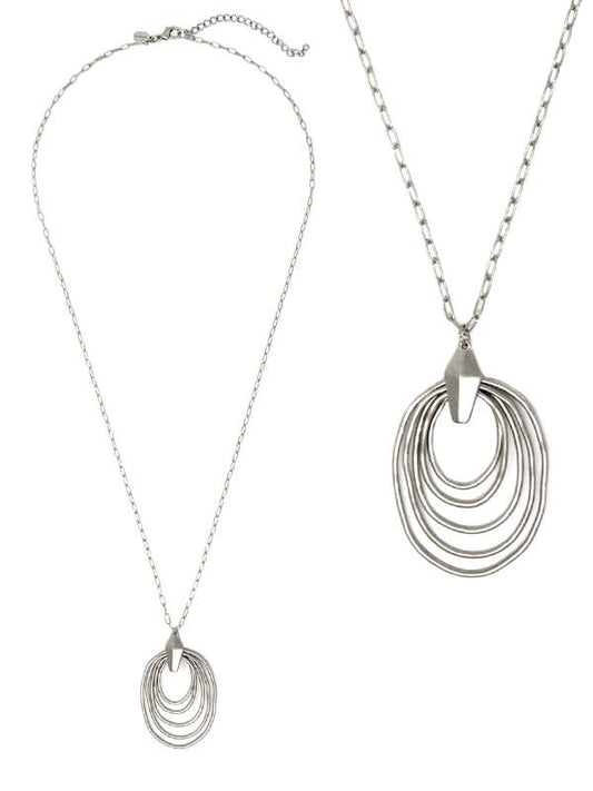 Silver necklace with multiple circular pendant on a white background