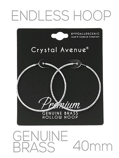 Crystal Avenue hoop earrings on a black card with product details.