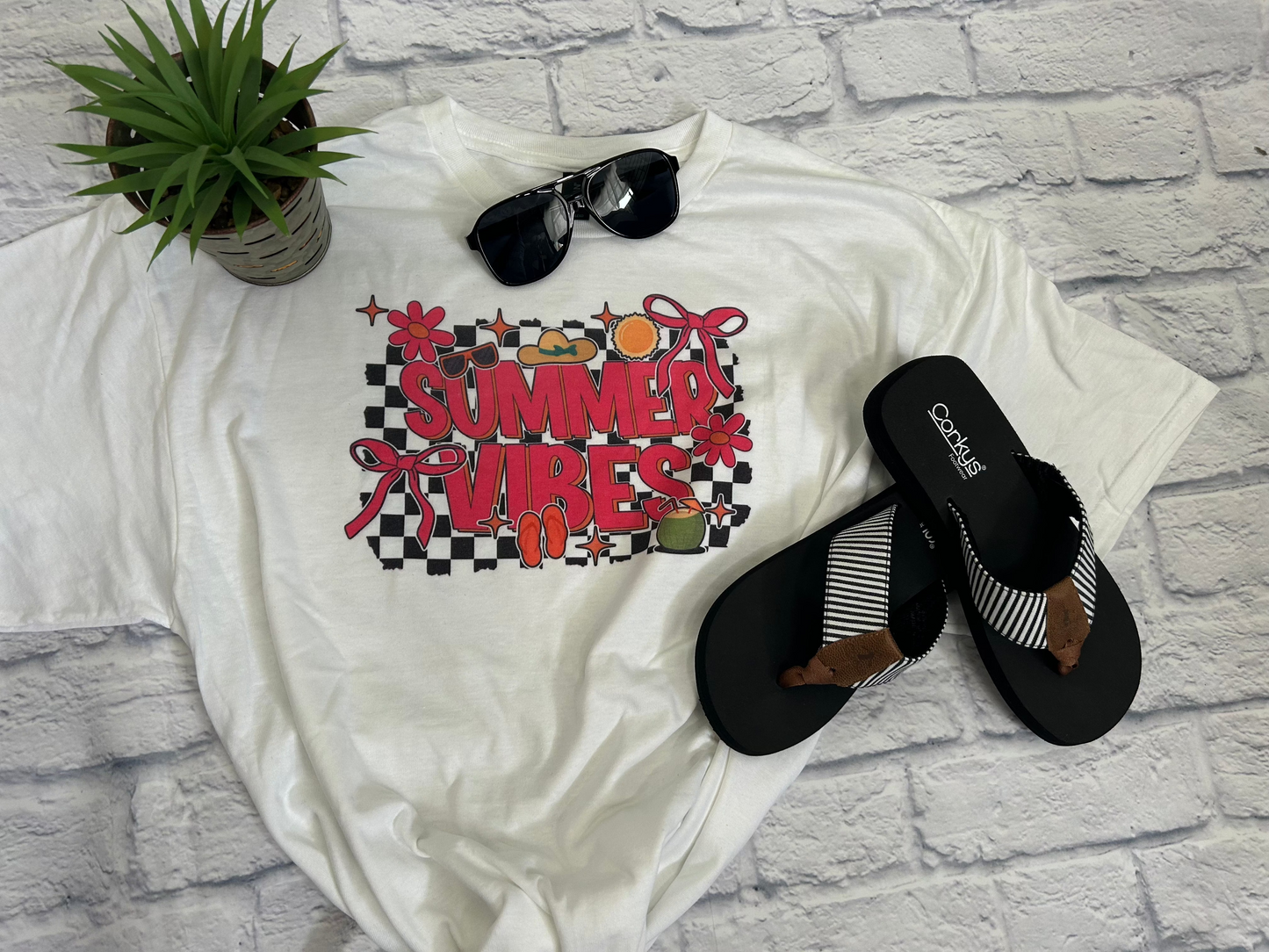 Experience the ultimate summer vibes with our cute graphic tee! Perfect for wearing everywhere, this tee will add fun and style to your wardrobe. Stay stylish and comfortable all season long with our Summer Vibes Tee.&nbsp;

Gildan Dryblend, 50% cotton, 50% polyester: unisex fit, true to size