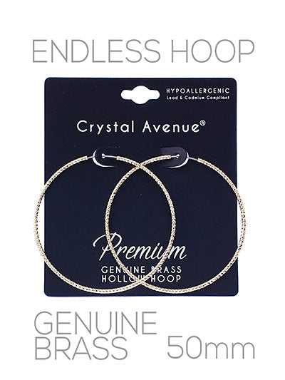 Crystal Avenue hoop earrings on a black card with product details.