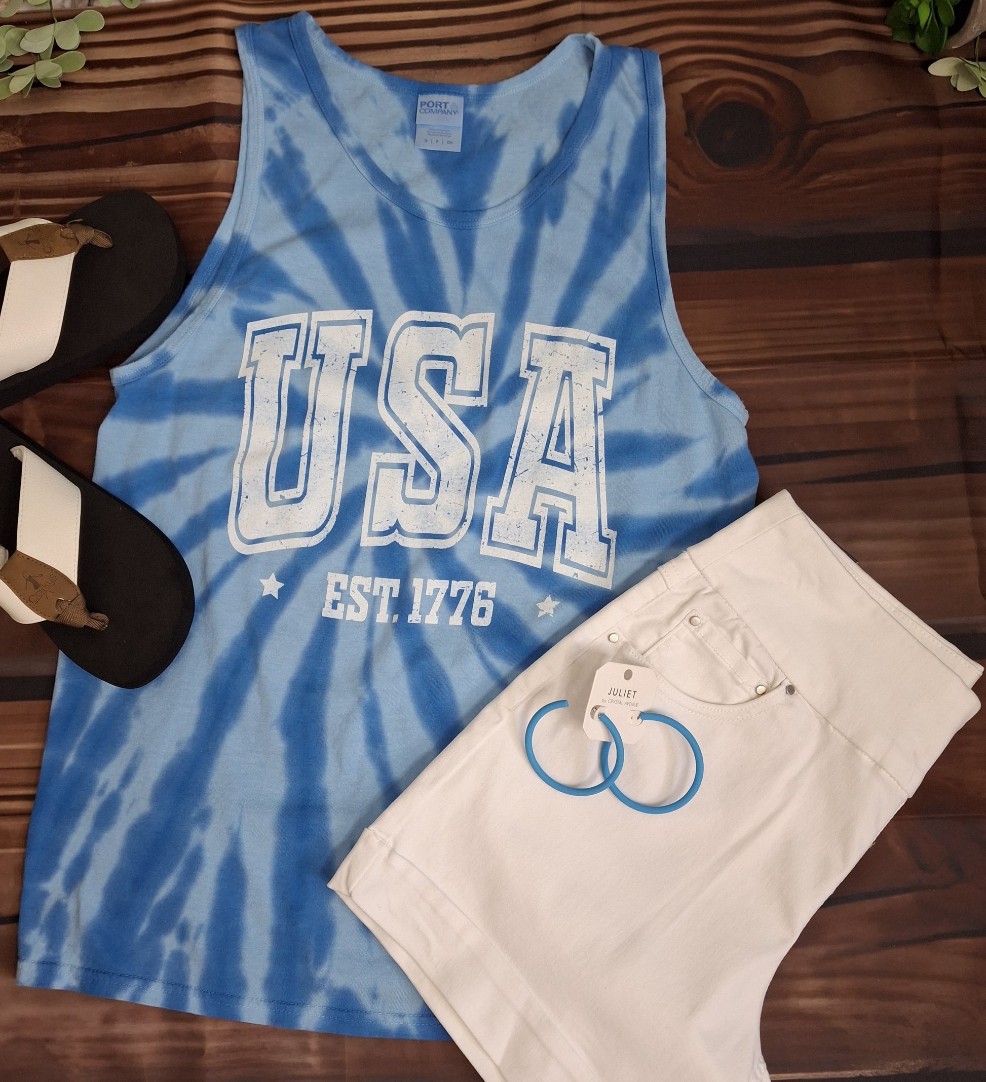 Celebrate summer in style with our USA Tank! Made from soft, lightweight fabric, this tank features a trendy tie dye design and an easy fit. Perfect for any summer occasion, show off your patriotic pride in this must-have piece.

100% Cotton
