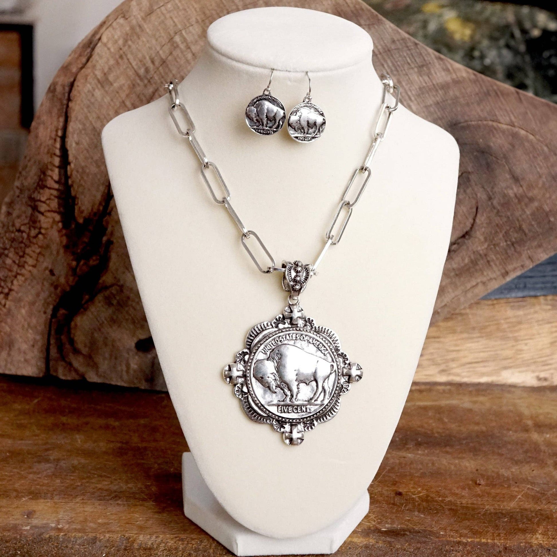 Silver Necklace set with a large round medallion with a buffalo in the center and matching earrings