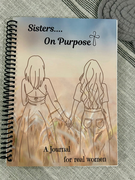 a journal for real women, with coloring pages, scriptures, reflections and more
 the cover shows two women holding hands in a wheat field