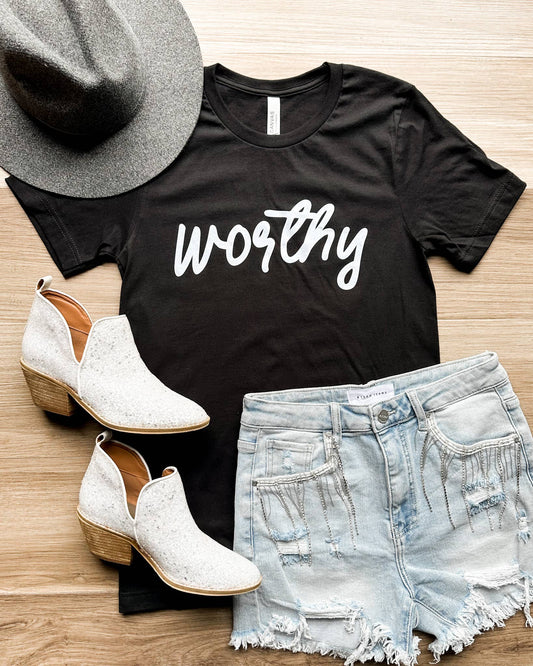 Say it all with our Worthy Black Graphic Tee. Made with super soft fabric, this tee sends a simple yet powerful message, even on days when we don't feel it. Remember your worth in this comfortable and impactful tee.

unisex fit/Bella Canvas/USA strong/52%cotton/48%polyester