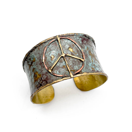Our Handcrafted Brass Patina Cuff features a beautiful patina finish that enhances the natural beauty of brass, creating a unique and vibrant color palette. Perfect for adding a bold statement to any outfit, this cuff is both an accessory and a conversation piece. Minimum 2 per cuff.