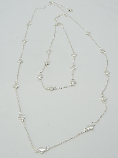 2 clover station silver necklaces on a white background