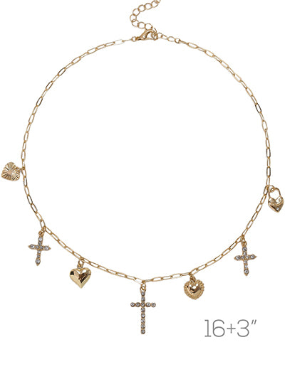 A gold charm necklace with hearts and crosses on a white background