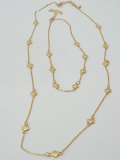 
2 clover station gold necklaces on a white background
