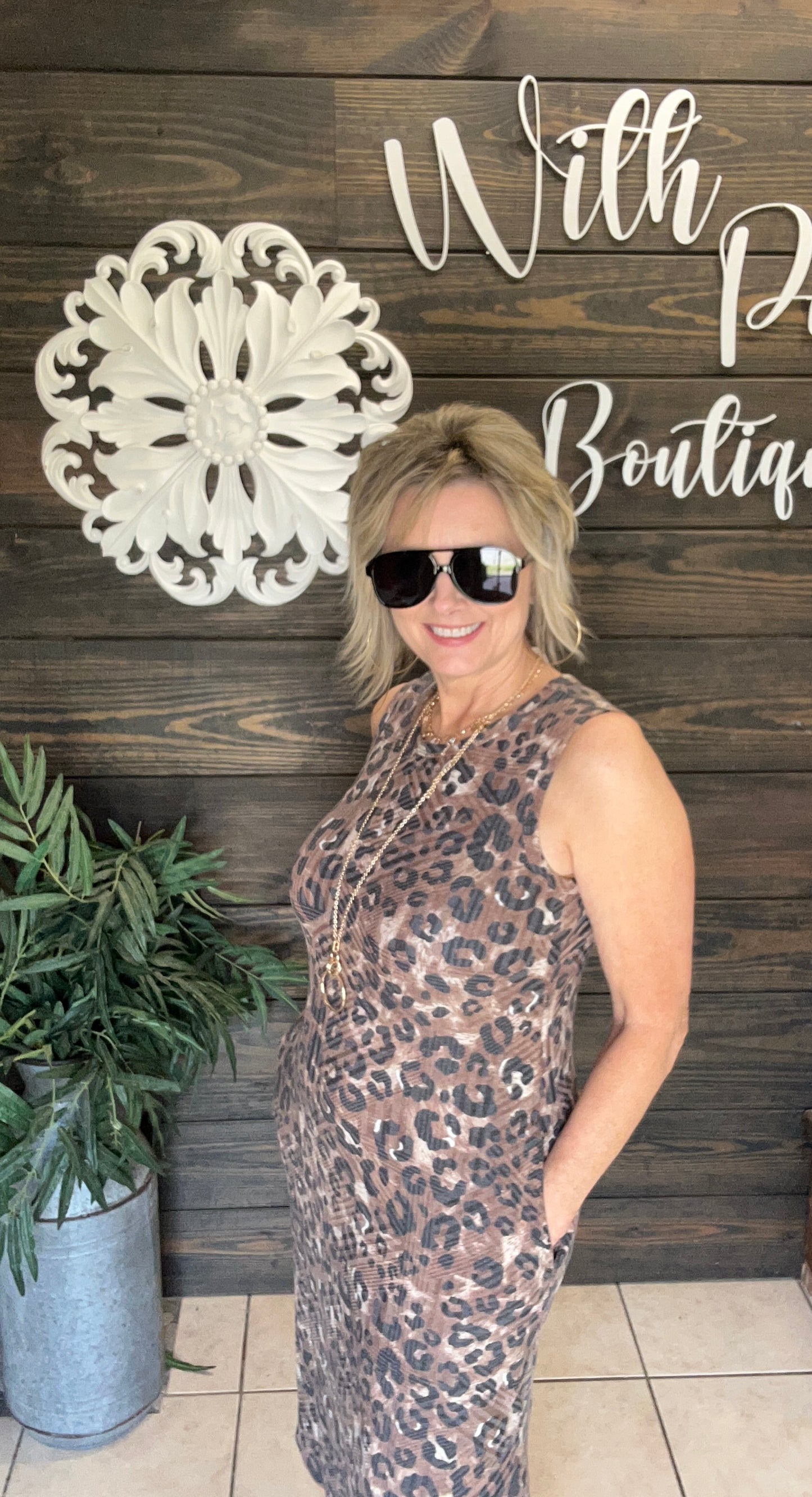 You will love the comfort and versatility of this sleeveless leopard print midi dress, designed to keep you cool and comfortable all day. Its versatile cut makes it perfect for casual outings or dressier occasions, while the trendy animal print adds a bold, fashionable edge. Perfect for layering with vests or denim jackets, making it perfect for every season. And you know it has pockets!! (Ladies its bra friendly!)

&nbsp;95% Polyester 5% Spandex Made in USA!

Fits relaxed