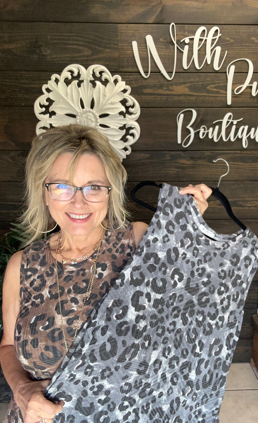 You will love the comfort and versatility of this sleeveless leopard print midi dress, designed to keep you cool and comfortable all day. Its versatile cut makes it perfect for casual outings or dressier occasions, while the trendy animal print adds a bold, fashionable edge. Perfect for layering with vests or denim jackets, making it perfect for every season. And you know it has pockets!! (Ladies its bra friendly!)

&nbsp;95% Polyester 5% Spandex Made in USA!

Fits relaxed